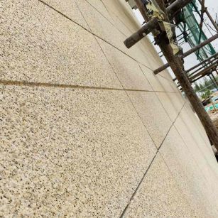 吉林市 黄金麻花岗岩荔枝面外墙干挂石材效果示例