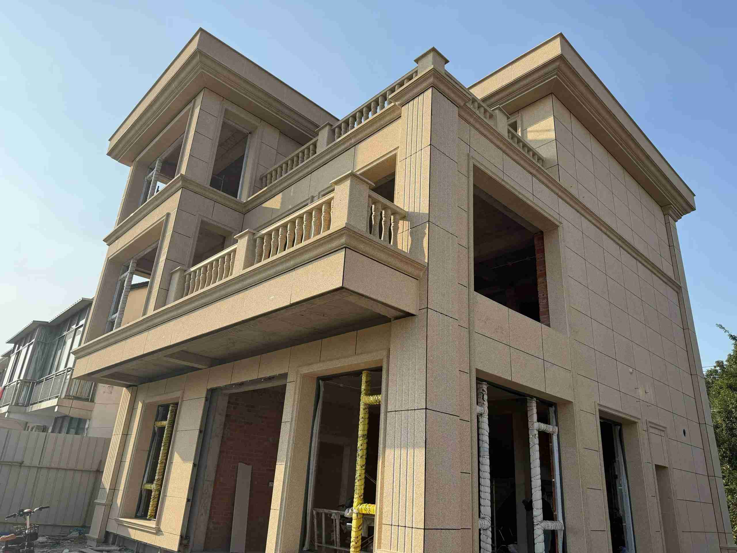 吉林市 黄金麻花岗岩石材荔枝面外墙干挂效果展示